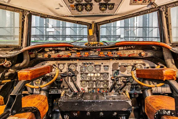 The instrument panels and controls of an aircraft cockpit.